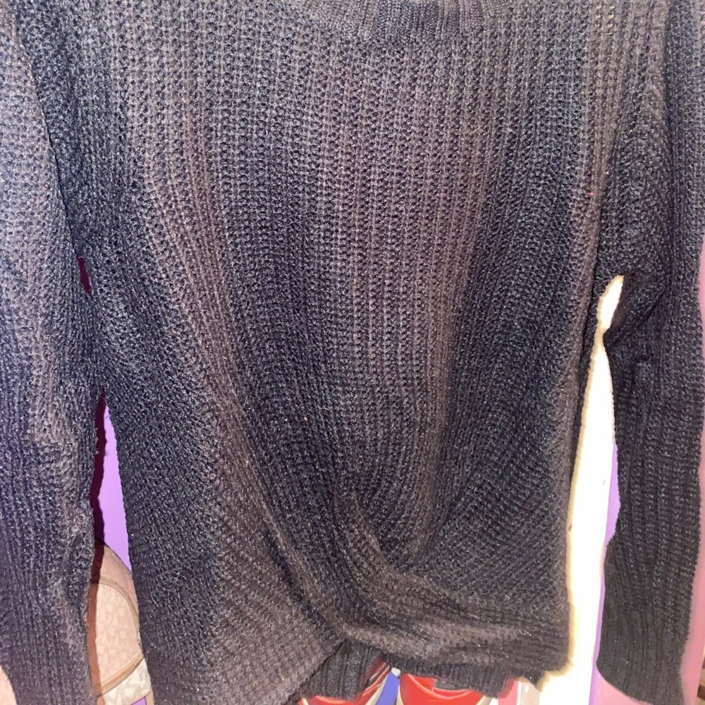 Bow type at bottom of cropped sweater